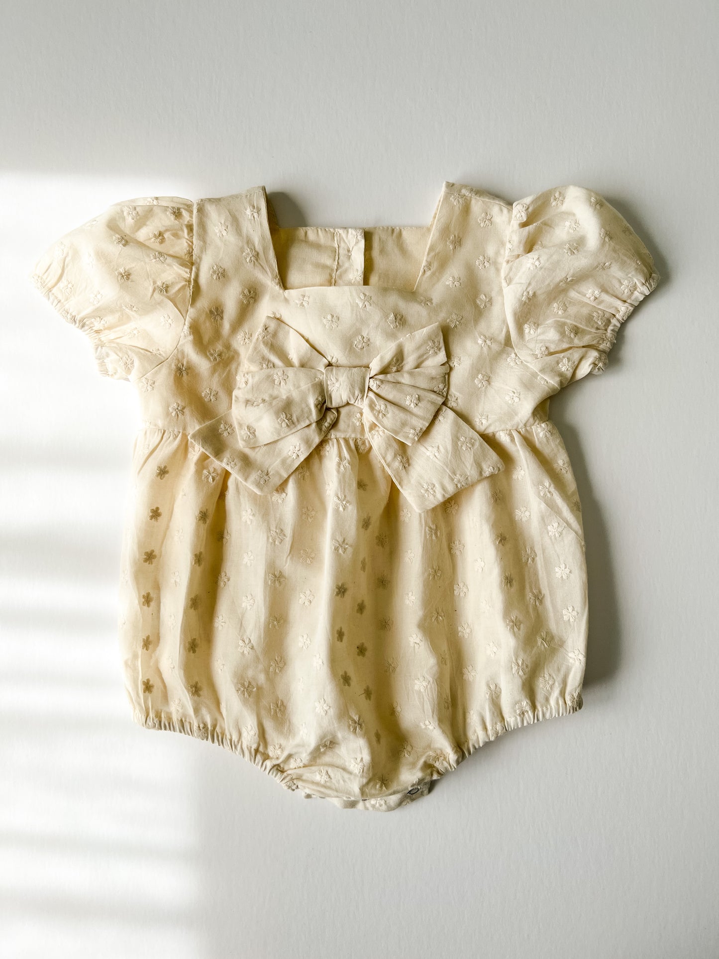 LINEN BOW FRONT ROMPER - DAISY EMBROIDERED